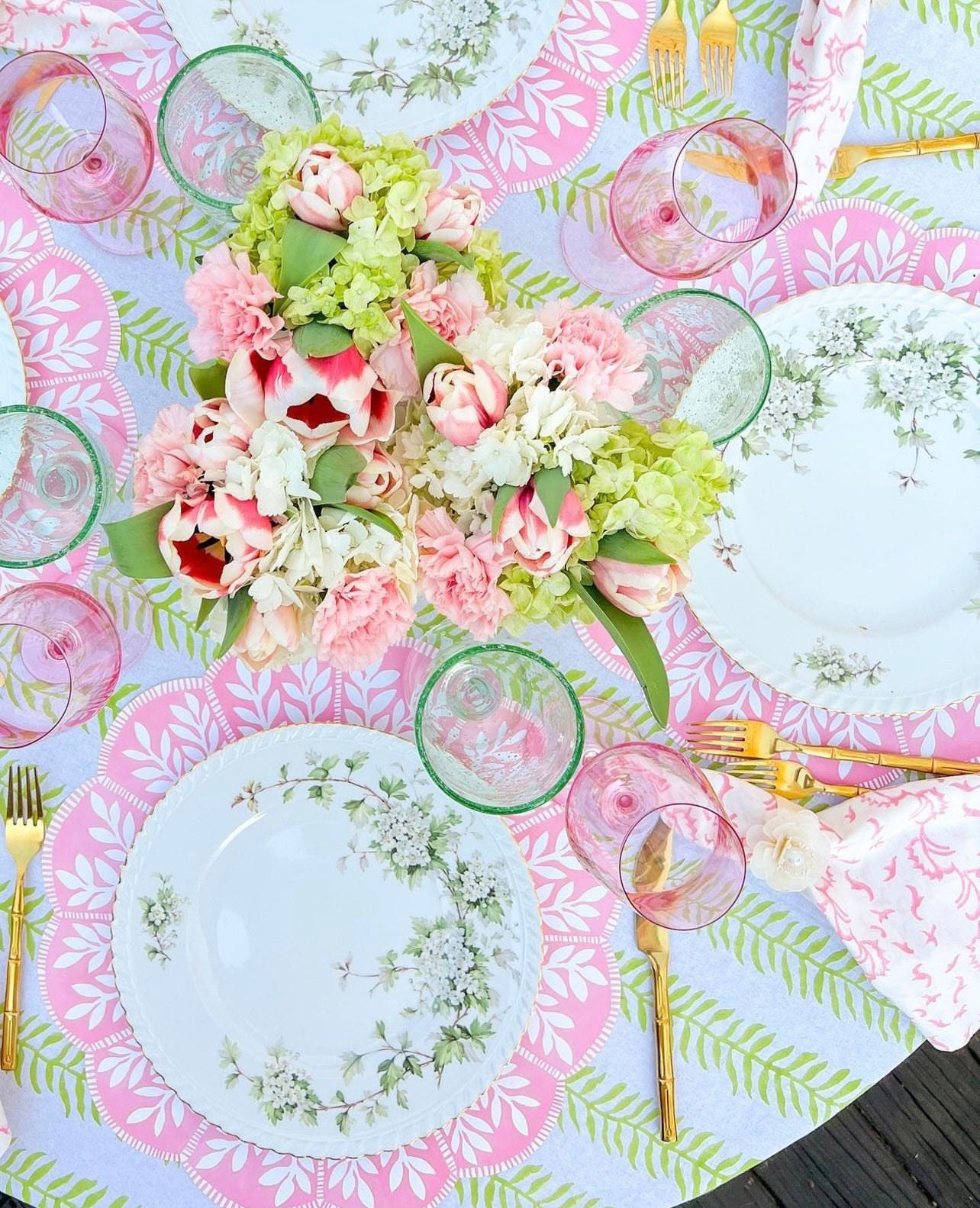 Spring tablescape featuring our pink and white scalloped paper placemat with vine pattern