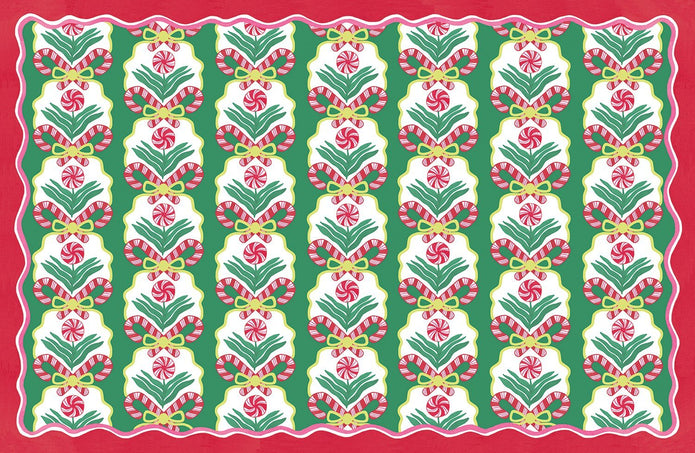 Paper placemat featuring red and green peppermint candy pattern on a green background with a red border