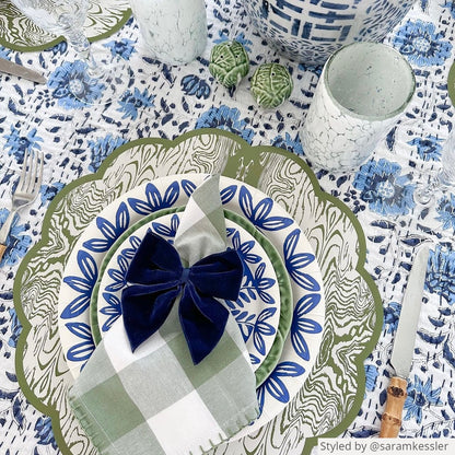 A blue and green fall themed tablescape featuring our navy blue bow napkin tie, blue heavy duty paper plates, and Wood scalloped paper placemats